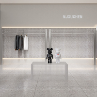 Porte-vêtements rotatif en acier inoxydable, style luxe léger, pour boutique de vêtements