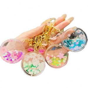 Joli porte-clés pendentif en forme de cœur avec fleur de cerisier, bouteille d'huile, accessoires pour sac, porte-clés de voiture, pendentif liquide Kawaii, cadeau - Product Image 1