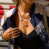 Collier Pendentif Œil Élégant avec Breloque Hamsa, Cristal Doré, Œil Bleu, Cordon Noir – Bijoux en Gros Personnalisables pour Femmes