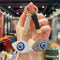 Le nouveau porte-clés œil du diable serti de diamants convient aux décorations intérieures de voiture, aux pendentifs de sac ou aux cadeaux commémoratifs