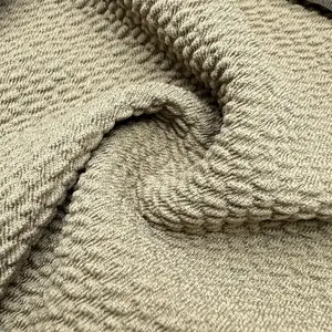 High Quality Soft Millet Grain Jacquard Polyester Ammonia Knitted Jacquard Fabric For Fashion