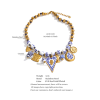 Collier élégant JINYOU 5881 avec pendentif cœur en céramique émaillée bleu et blanc, perles en céramique et acier inoxydable, et breloque animale en métal