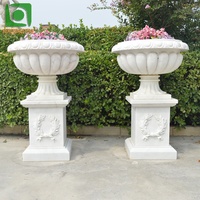 Jardinière en marbre blanc rond simple pour décoration extérieure, motif floral gravé