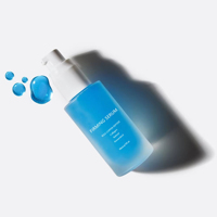 Nouvel emballage cosmétique de luxe bouteille de lotion pour fond de teint en verre ambré givré bouteille de crème d'huile pour sérum de soin de la peau en verre noir avec pompe