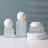 Ensemble d'emballages de luxe givrés pour soins de la peau avec couvercle sphérique unique, flacon et pot en verre de 20 ml à 120 ml pour marque de cosmétiques bio