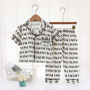 Vente directe usine de pyjamas pour enfants, ensembles en gaze à manches courtes, col à boutonnage simple, imprimé dessin animé, pyjamas pour filles. - Product Image 5