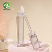 Tube de gloss à lèvres transparent de luxe de forme ronde avec bouchon à vis et applicateur, emballage cosmétique en plastique vide personnalisable
