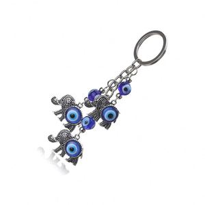 Best Sellers Alloy Turkish Evil Blue Eye 3 Lucky Elephants Pendant Keychain for Users - Product Image 4
