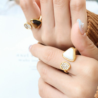 Bague en acier inoxydable plaqué or Pvd de personnalité de la mode de luxe incrustée d'oeil de tigre pierre Zircon coquille bagues pour femmes