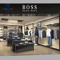 Présentoir de vêtements en métal noir personnalisé avec logo pour magasin de vêtements pour hommes, support de présentation de costumes, présentoir de vêtements de détail