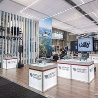 Stand d'exposition modulaire 30x30 en îlot avec affichage LED SEG et salle de réunion pour l'US Aircraft Expo Palo Alto 2027