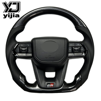 Les fabricants fournissent l'ensemble de volants en fibre de carbone Yamaha LC300 pour toute la série avec motif en fibre de carbone