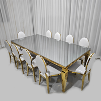 Ensemble de table à manger rectangulaire avec plateau en verre miroir et base en acier inoxydable doré
