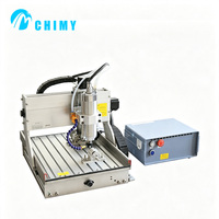 Mini machine de gravure CNC 4 axes 3040 avec broche à refroidissement par eau pour la sculpture 3D ronde et plate destinée à la fabrication artisanale