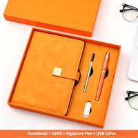 Ensemble cadeau orange de 4 pièces : carnet A5 avec logo personnalisé, patch doré, stylo, recharge et clé USB
