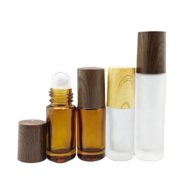 Bouteille de parfum de luxe fantaisie 5ml 10ml en verre ambré/dépoli déodorant avec couvercles en acier inoxydable métallique et lignes en bois
