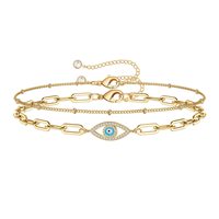 Pulsera de cadena de acero inoxidable con diseño de ojo de diablo y ojos azules, microincrustaciones de circonita y efecto de goteo de aceite.