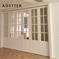 Puerta Plegable de Aluminio Estilo Francés Blanca AOSTTER con Vidrio Templado Transparente y Riel Empotrado para una Elegante Casa de Campo