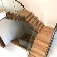 Escalier en zigzag à marches ouvertes en acier et bois avec garde-corps à câbles pour projets de rénovation résidentielle - Vente chaude