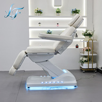 Lit de beauté ergonomique réglable de luxe avec système hydraulique électrique et lit de massage incurvé personnalisé pour salon professionnel