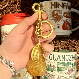 Wholesale Gilded Pear Keychain Elegant Green & Gold Pear Pendant with Triple <b>Leaves</b> Fashionable Bag Charm & Keyring Accessory - Product Image 4