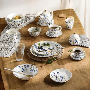 Wholesale Luxurious Gold Rim Decorative Blue Hand-painted Royal White Ceramic Dinnerware Creative Modern Luxury Dinner Set