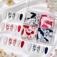 96 faux ongles en ABS de style français, en boîte, forme amande, motif pois et nœud papillon, doux et tendance, réutilisables, couvrance totale avec colle