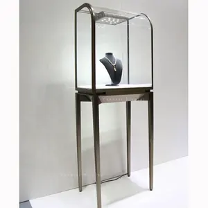 Vitrine de aço inoxidável luxuosa para joalheria, caixa de vidro com design de relógio, suporte de exibição para móveis interiores