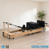 Reformer de Pilates en bois de chêne certifié ISO CE, lit de Pilates pliable et barre de pieds réglable avec ressorts OEM ODM