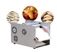Machine électrique automatique de petite taille pour la maison - idéale pour la fabrication de croissants dans les boulangeries. Il est utilisé pour façonner la pâte et le lait.