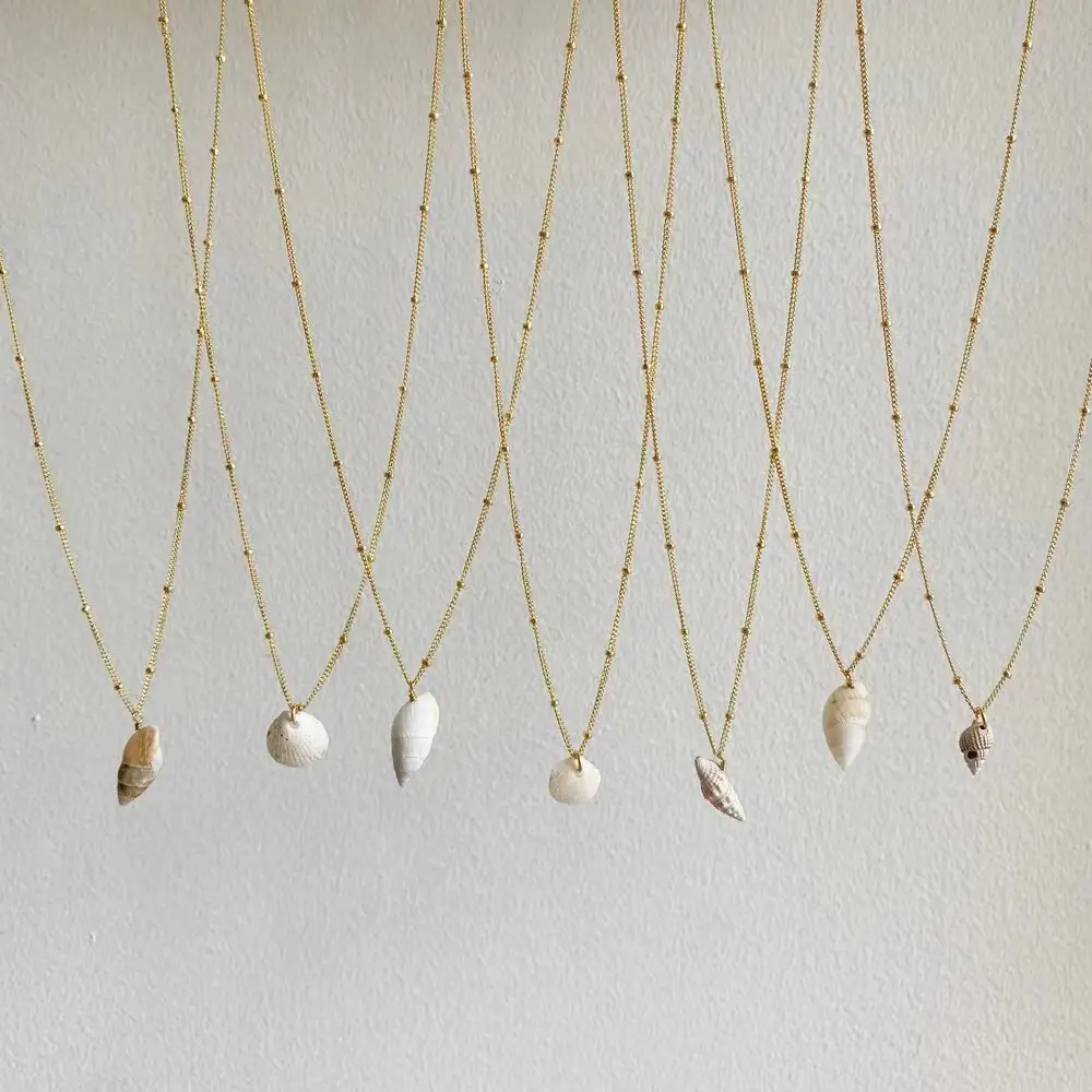 Dody — collier avec chaîne remplie or, pendentif coquillage unique, édition limitée, satellite