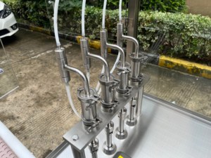 เครื่องบรรจุและปิดฝาขวดและหลอดแบบอัตโนมัติ 4 หัว แบบปั๊มกลไก สำหรับบรรจุของเหลว ปริมาณ 5-200 มล. - Product Image 2