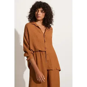 Women Collared long sleeve shirt Oversized fit Button up front and cuffs Fabric covered button Dropped shoulder linen shirt