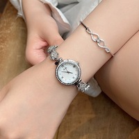 Montre-bracelet Shigaodi ronde de style Ins, élégante et tendance, avec bracelet rotatif incrusté de diamants pour femmes, nacre