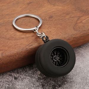 Promotion Porte-clés Pendentif en PVC souple style dessin animé, en forme de pneu de voiture, avec accessoires métalliques artificiels et modèle de moyeu de roue modifié en silicone - Product Image 2