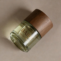 Botella de Perfume de Vidrio Transparente Cilíndrica Personalizada con Logotipo Dorado de 30 ml, 50 ml, 100 ml, con Pulverizador y Tapa de Madera