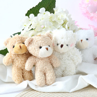 Ours en peluche à grosse tête, peluche courte et coton PP, emballage en sac en filet, accessoires de bouquet, pendentif