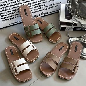 Versione coreana transfrontaliera estiva Casual con tacco piatto da donna <span class=keywords><strong>per</strong></span> pantofole nuovi sandali a fondo piatto/scivoli <span class=keywords><strong>per</strong></span> scarpe da spiaggia al mare - Product Image 1