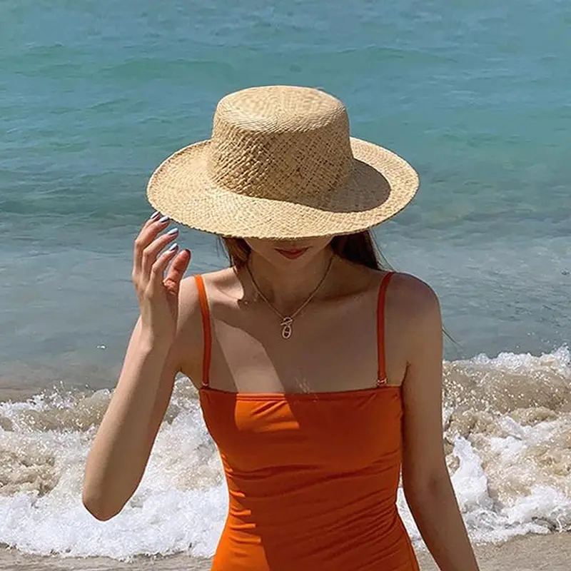 Çevre dostu rafya dokuma hasır kova şapka yaz tatil güneşlik plaj şapkası kadın erkek klasik Minimalist düz üst hasır şapkalar