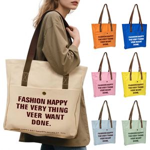 Sac fourre-tout en toile crème avec poche avant, bouton-pression et impression de slogan pour étudiants, courses quotidiennes et travail - Product Image 1