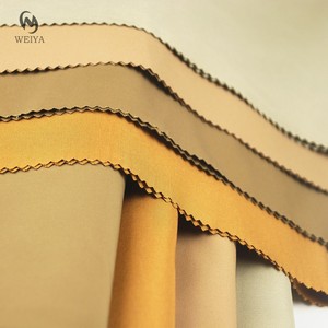 เสื้อปาร์เกอะแฟชั่นผ้าเทรนช์โค้ทผ้าโพลีเอสเตอร์ย้อมสีทึบสีกากีกันน้ำ - Product Image 1