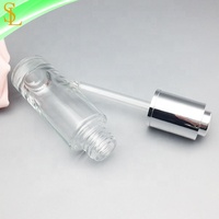 Flacon compte-gouttes cylindrique vide en verre de 30 ml avec pipette et capuchon argenté, sérigraphié pour sérum de soin et huile essentielle