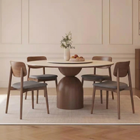 Table à manger en bois massif de style rétro français avec quatre chaises, combinaison haut de gamme, table ronde simple pour appartement ou villa