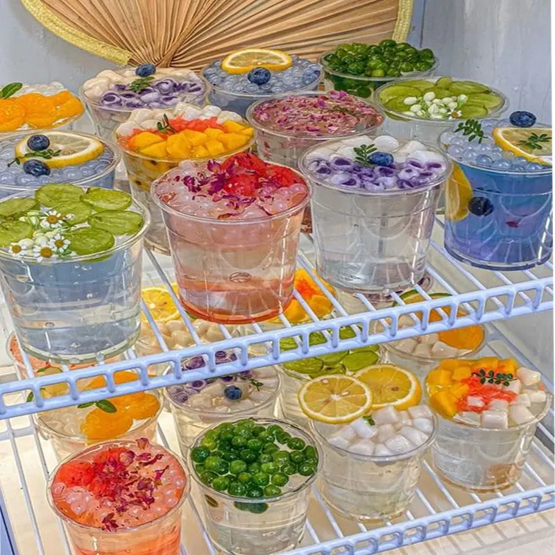 Vente en gros de seaux à boissons en plastique jetables de haute qualité contenant des fruits gobelets transparents avec poignée de couvercle