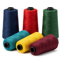 %100 Polyester Yüksek Sıcaklığa Dayanıklı Merserize Spun Boyalı Dikiş İpliği Yüksek Mukavemetli Nakış Tığ İşi El Örgüsü İçin