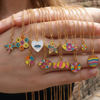 Collier pendentif F364 Boho Chic multi-motifs en émail, plaqué or, acier inoxydable, avec motifs œil, cœur et étoile, pour superposition