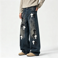 Jeans amples à coupe croisée de style américain haut de gamme pour hommes, avec patchs en cuir croisés et motifs brodés