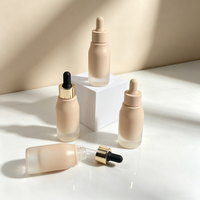 Flacon compte-gouttes carré personnalisé de 30 ml en verre dépoli avec gravure, fond épais, pour huiles essentielles et sérums, idéal pour l'emballage de produits de soin.