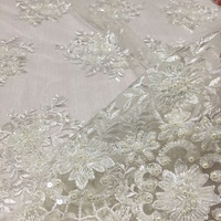 Nouveau tissu en tulle brodé avec des perles à la main, des paillettes et de la dentelle brodée pour les robes de mariée
