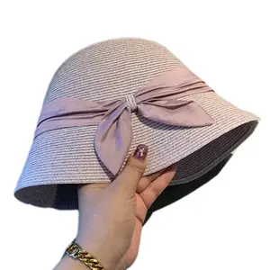 Heiß verkaufen Mode Frauen rosa Stroh Eimer Cloche Hut Strand Upf50 UV-Schutz Sonnenhut für Reisen mit Bowknot